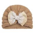 Detailed view of khaki baby turban hat with lace bow and elegant pearl embellishments - Coffee