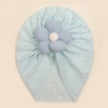 Detail of baby hat with light blue lace texture and large striped flower ornament - Blue