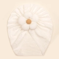 Close-up of baby turban hat with hollow-out embroidery and 3D floral decoration - White