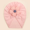 Detail of pink baby beanie featuring hollow lace patterns and a 3D ribbed flower ornament - Pink