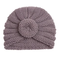 Detail of purple infant turban hat featuring thick knit texture and center floral knot - Gray