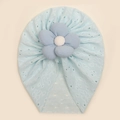 Close-up of light blue baby turban hat featuring delicate floral cutout patterns - Blue