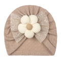 Detail of baby knit hat with khaki cable texture, white flower and sequin mesh bow - One Size / Coffee