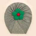 Detail of baby turban hat showing grey hollow-out knit pattern and large 3D fabric flower - Light Green