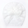 Close-up of white lace baby hat with a large mesh bow and delicate hollow texture - White