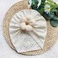 Turbante per neonato bianco panna con ricamo a traforo e una grande decorazione floreale - Taglia unica / Beige