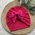Bonnet turban bébé rose fuchsia avec un grand nœud décoratif sur un bonnet doux - Rose rouge