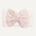 Close-up of soft baby pink nylon headband featuring a large decorative bow for infants - Light Pink