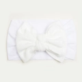 Close-up of a soft white nylon baby headband with a large decorative bow detail - White
