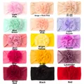 Vue à plat de 15 bandeaux bébé en nylon colorés avec grandes fleurs en mousseline - 15 Couleurs Mélangées