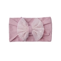 Detailed close-up of a soft pink elastic baby headband with a sequined mesh bow decoration - Taro Purple