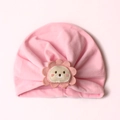 Detail of baby pink turban hat with cute lion embroidery and soft pleated cotton texture - One Size / Pink