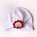 Close-up of white pleated cotton baby turban with red lion sunflower embroidery - One Size / White