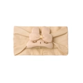 Close-up of beige baby headband with cute 3D bunny ears and gold ribbon detail - Light Coffee