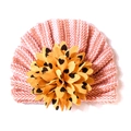 Detail of pink and white striped baby turban featuring a large yellow floral ornament - One Size / Coffee