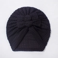 Close-up of black waffle-knit baby turban hat with a triple-layered decorative bow - One Size / Black