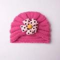 Knitted baby turban in rose red featuring a pink polka dot flower and soft yarn - Rose Red