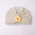 Cozy cream knit baby turban hat with a yellow crochet flower for winter warmth - Beige And Yellow