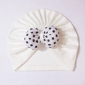 White baby turban hat with a contrasting black polka dot bow for newborns and infants - White