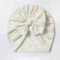 Dettaglio cappello neonato in maglia a nido d'ape bianco avorio con pois e grande fiocco - Bianco avorio
