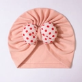 Pink baby turban hat featuring a large red and white polka dot bow decoration - Orange