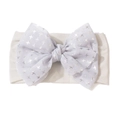 Close-up of soft nylon baby headband with a lavender tulle bow and silver star patterns - Gray