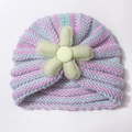 Detailed knit pattern on baby beanie featuring pink stripes and a green flower accent - Mint Green