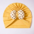 Yellow baby turban hat with a large beige and brown polka dot bow decoration - Yellow