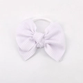 Cute lavender knitted bow headband with ribbed texture for infants and toddlers - White