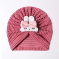 Detail of waffle knit fabric and cute plush rabbit on the pink infant beanie - Rose Red