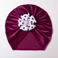 Detail of soft dark purple velvet baby hat featuring a polka dot fabric flower and button - Purplish Red