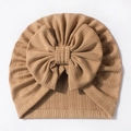 Detailed close-up of soft waffle texture and decorative bow on the baby beanie - Coffee