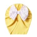 Detail of baby turban hat with yellow ribbed fabric and a large white bow with star prints - One Size / Yellow