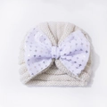 Süße beige Baby-Strickmütze mit großer lila Schleife und silbernen Sternmustern - Einheitsgröße / Beige