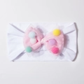 Detailansicht eines Baby-Haarbands aus weißem Stoff mit rosa Tüllschleife für Kinder - Weiß