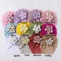 Detailed flat lay of 12 colorful ribbed knit baby turbans with decorative fabric flowers - 12 Colors Mixed