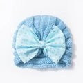 Soft light blue knitted baby hat featuring a large matching bow with silver star prints - One Size / Navy Blue