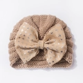 Newborn baby knit hat in camel brown with a large printed bow decoration for winter - One Size / Coffee