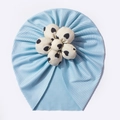 Close-up of baby turban fabric with light blue rib texture and white heart flower - Blue