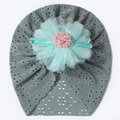 Detail of baby fontanelle hat featuring mint green mesh petals and pink pompom on grey lace - Light Green