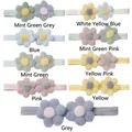 Détail de neuf bandeaux pour bébé avec fleurs en peluche colorées et bandes élastiques - 9 Couleurs Mélangées