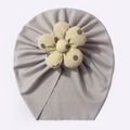 Detailed view of light grey ribbed baby turban hat with a yellow polka dot flower ornament - Gray