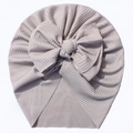 Detail of grey ribbed knit baby turban hat featuring a large soft decorative bow - Gray
