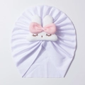 Close-up of white ribbed knit baby turban hat with cute plush bunny and pink bow detail - White