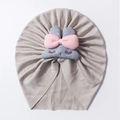 Detailed view of grey ribbed baby turban with plush bunny ears and pink bow detail - Gray