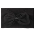 Détail d'un bandeau en nylon noir souple avec un grand nœud décoratif en mousseline pour bébé - Noir