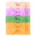 Set of 4 soft elastic nylon headbands with large bows for infants in vibrant colors - Light Pink,Lavender,Grass Green,Orange Yellow
