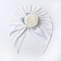 Close-up of white breathable hollow-out baby turban hat with large rose floral detail - White