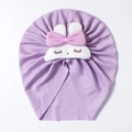 Close-up of purple ribbed baby beanie with a cute white rabbit patch and pink bow detail - Purple