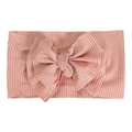 Detailed macro view of light pink ribbed knit texture on soft infant bow headband - Nude Pink